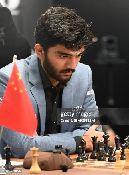 indias grandmaster gukesh dommaraju competes against chinas chess grandmaster ding liren in